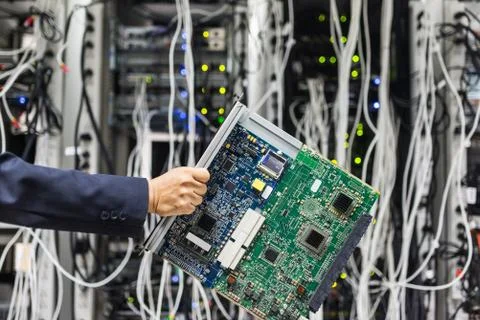 People fix core switch in network room Stock Photos