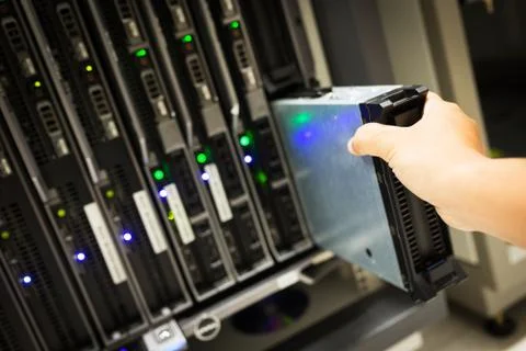 People fix node fiber optic in network room Stock Photos