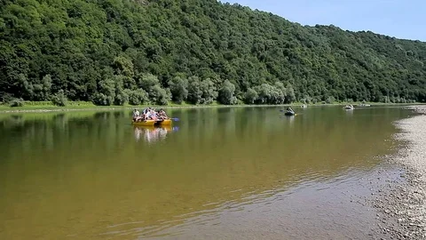 People float down the River on catamaran Stock Footage 70111531
