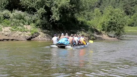 People float down the River on catamaran Stock Footage 70144666