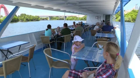 People float on a pleasure river boat and turn around Stock Footage 51110315