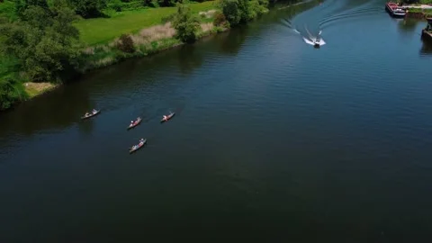 People float on the river on boats with oars Stock Footage 155413212