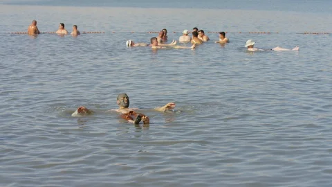 People floating in the Dead Sea Stock Footage 86764472