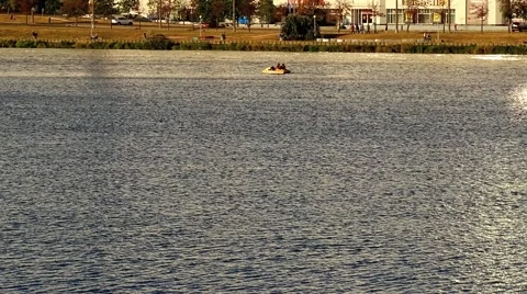 People floating down the river by boats on a sunny summer day Stock Footage 54114230