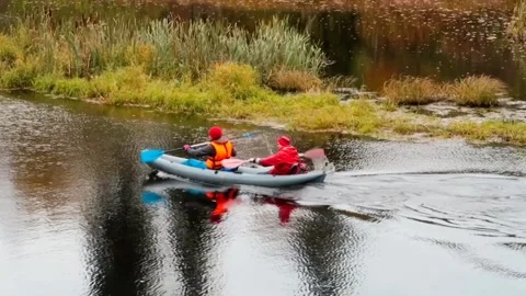 People floating down the river in a kayak Stock Footage 220066009