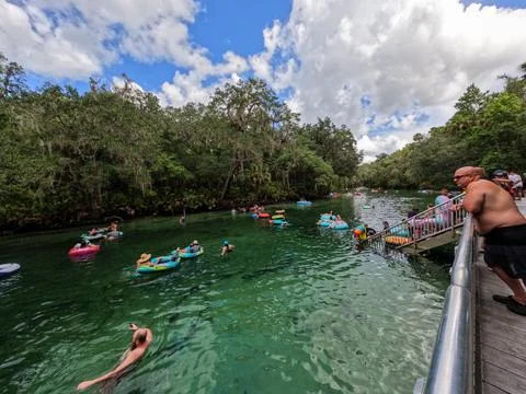 People floating down the spring in Blue Springs State Park in Florida. Stock Photos