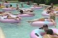 People floating in inflatable rings Footage