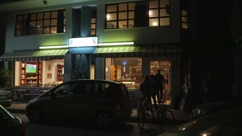 People flock to the cafe at night Stock Footage 138785533