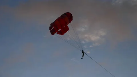 People flying on a parachute Stock Footage 203806273