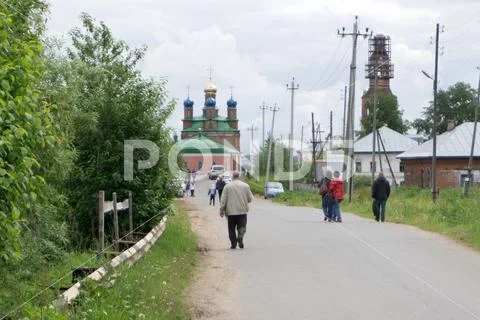 People in formal attire to get out of the village Orthodox Church is Stock Photos