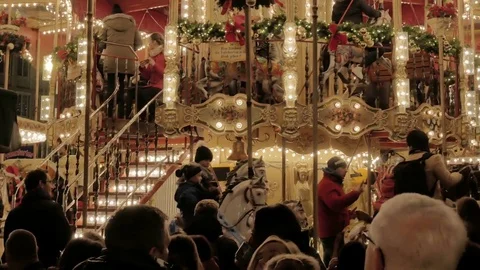 People in front of a carousel Stock Footage 70841989