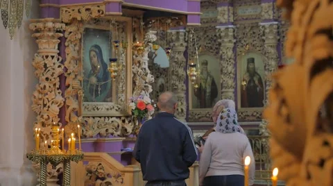 People in Front of Images in Carved Frames Interior of Holy Cross Monastery Stock Footage 64106833