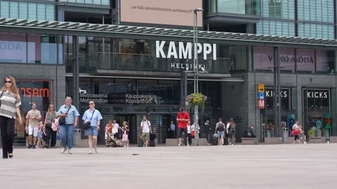 People in front of Kamppi shopping centre in Helsinki, Finland Stock Footage 340604246