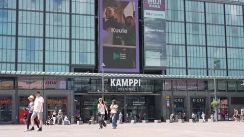 People in front of Kamppi shopping centre in Helsinki, Finland Stock Footage 340604357