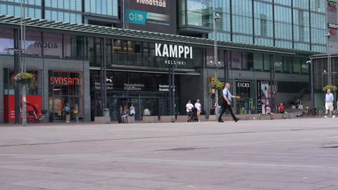 People in front of Kamppi shopping centre in Helsinki, Finland Stock Footage 340604376
