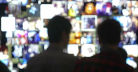 People in Front of Virtual Wall with Moving Pictures Stock-Footage 52391032