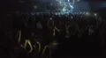 People with gadgets film Robbie Williams show. Singer dancing, walking on stage HD Footage
