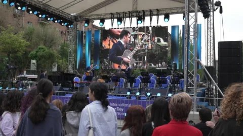 People gather around at Cascade Complex to listen to the Jazz Festival Stock Footage 188305470