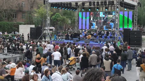 People gather around at Cascade Complex to listen to the Jazz Festival Stock Footage 188307145