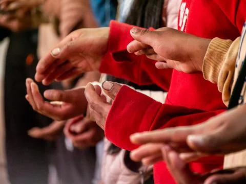 People Gesturing With Their Hands During Group Activity Foto stock