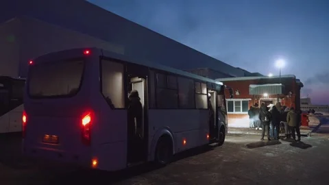People get off the bus, the bus drops people off Stock Footage 327621271