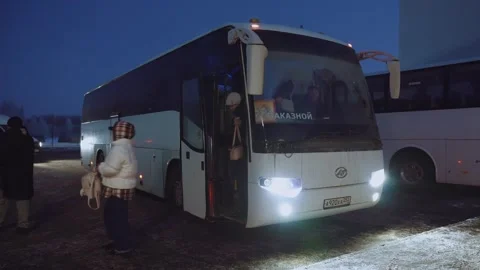 People get off the bus, the bus drops people off Stock Footage 327621293
