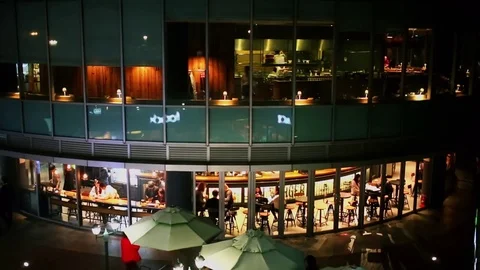 People get rest in cafe with illumination at night Stock Footage 70874630