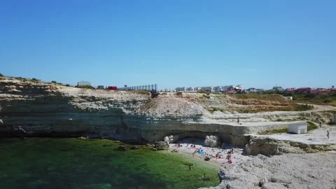 People get rest on small beach among rocks Stock Footage 299679674