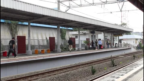 People get off the train and leave the platform Stock Footage 339946207