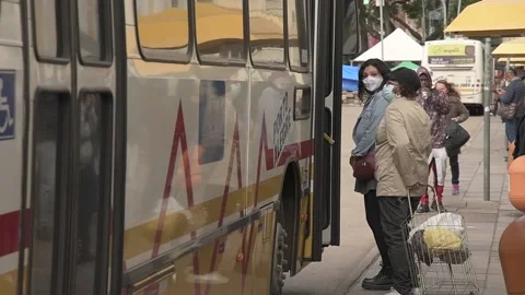 People getting on the bus Stock Footage 158397375