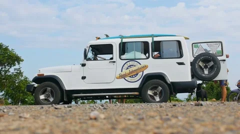People getting into the car on the beach. Visiting places of interest. Stock Footage 56298391
