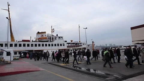 People getting off the ferry carrying passengers Stock Footage 148931926