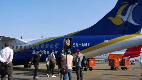 People getting inside an airplane of Buddha Airlines airplane during covid. Stock Footage 281317209