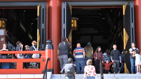 People getting inside and outside the Senso-ji Temple in Tokyo Japan Stock Footage 121387645