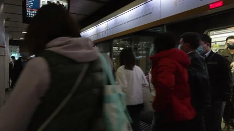 People getting out of subway train in coronavirus pandemic,Beijing,China Stock Footage 143046111
