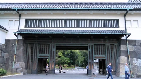People getting outside the Imperial Palace Gardens in Tokyo Japan Stock Footage 121405922