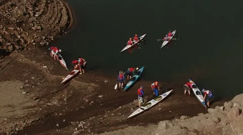 People getting ready to canoe on the dam Stock Footage 12264395