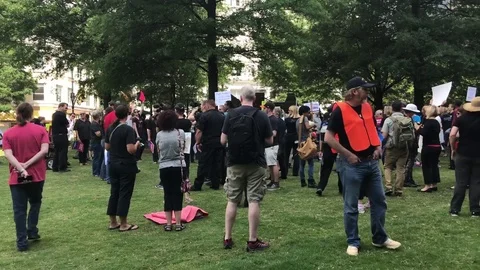People getting ready to protest against Trump on the streets of Atlanta Stock Footage 76835969