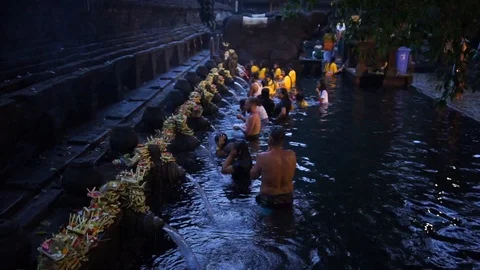 People getting ritual purification in The Holy Springs of Pura TIRTA EMPUL Stock Footage 113053353