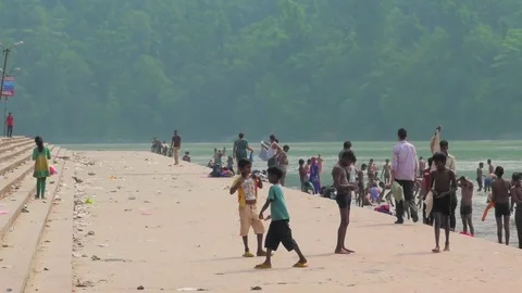 People at ghat of Ganges river in Rishikesh, India. Stock Footage 82923087