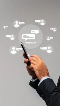 People giving feedback through mobile devices with various icons around on gray Stock Photos