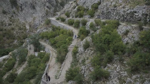 People go up and down the mountain trail. Kotor. Montenegro 2019 Stock Footage 119061681