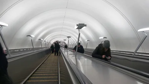  People go down the escalator, modern Moscow metro station "Fonvizinskaya" Stock Footage 73615254