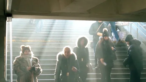People go down to underground with awesome light beams in winter Stock Footage 71721252