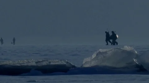 People go on the ice. Cold winter pattern. Fishermen go fishing. Stock Footage 112510862