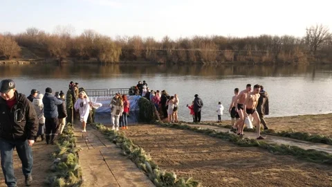 People go to the river. Bathing on the feast of Epiphany. Stock Footage 230734120