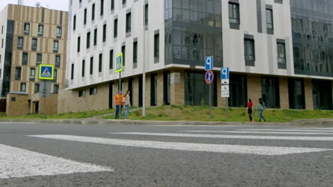People go in street of modern complex of apartment buildings Stock Footage 240119891