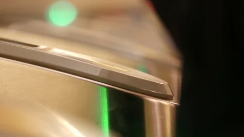People go into the subway through an electronic barrier. Ring with NFC RFID Stock Footage 126358635