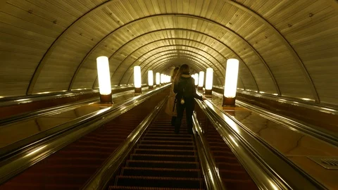 People going down with the escalator in the Moscow metro Video stock 99606315