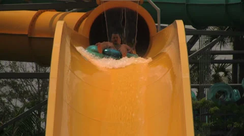 People Going Down Waterslide Drop on a Tube Stock Footage 31986063